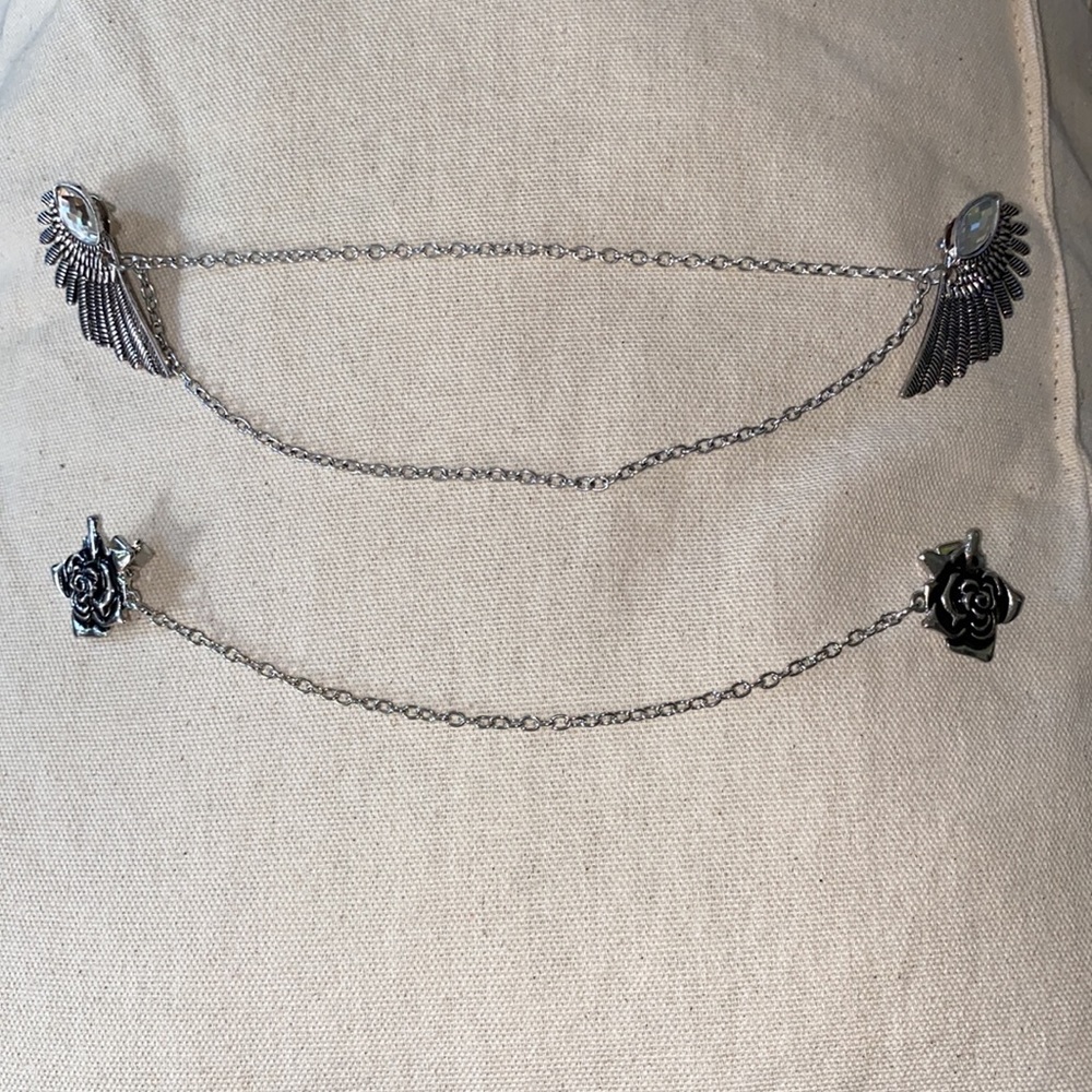 Two sweater/shawl closure clips — silver-toned.